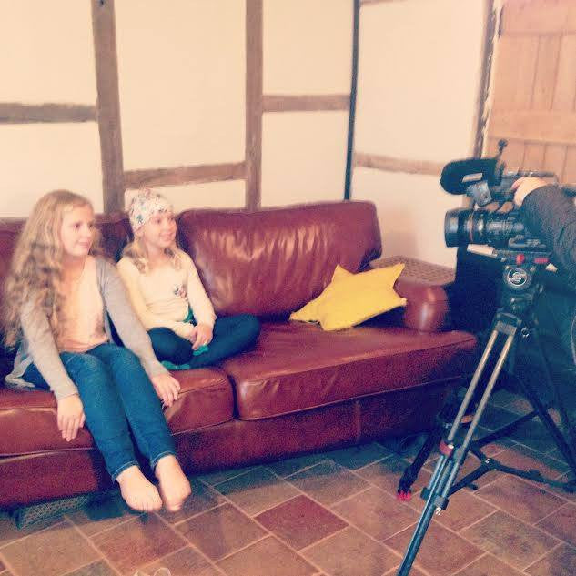 ITV TV Interview with Cancer survivor hat designer Emilienne and daughters at home.